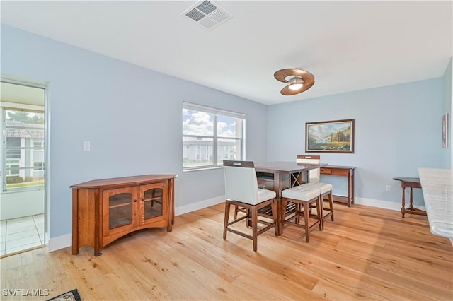 dining area with light wood-type flooring