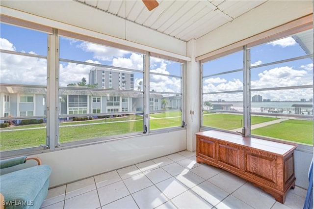 sunroom featuring a healthy amount of sunlight and ceiling fan