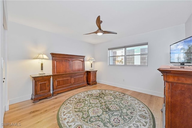 bedroom with light hardwood / wood-style flooring and ceiling fan