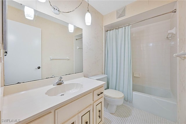 full bathroom with tile patterned flooring, vanity, toilet, and shower / bath combo with shower curtain