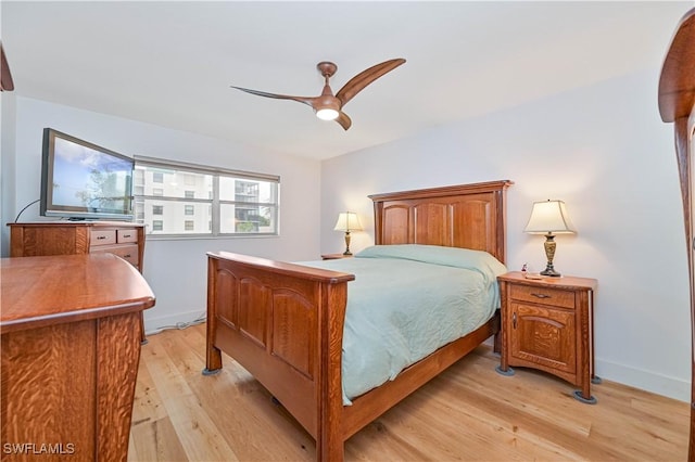 bedroom with ceiling fan and light wood-type flooring