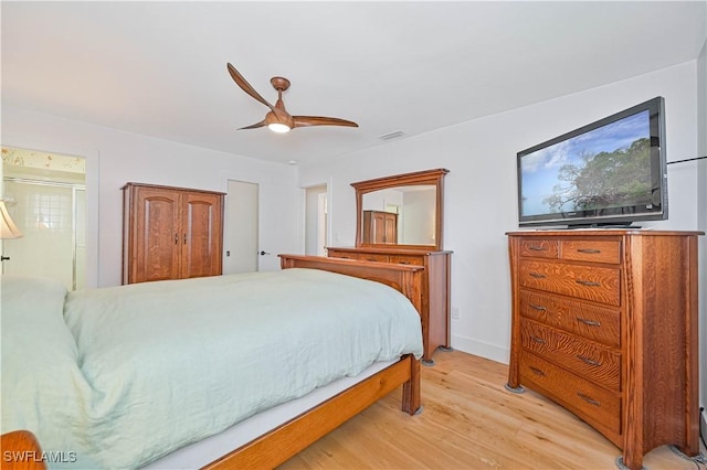 bedroom with light hardwood / wood-style floors and ceiling fan