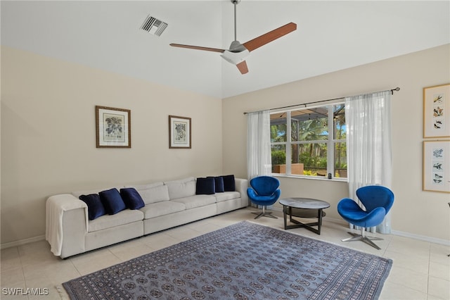 tiled living room featuring vaulted ceiling and ceiling fan