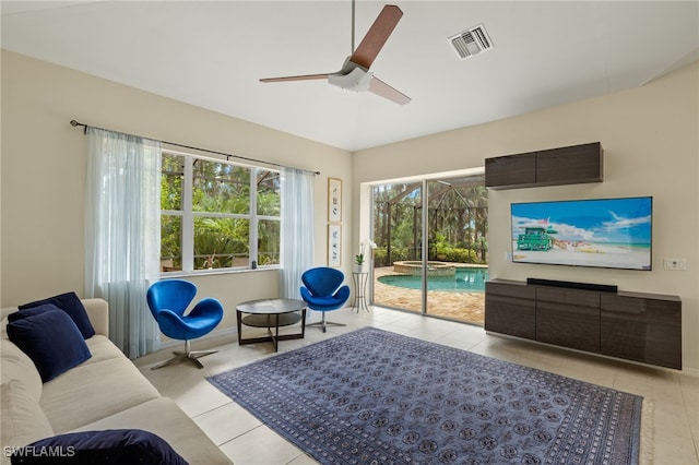 tiled living room featuring ceiling fan