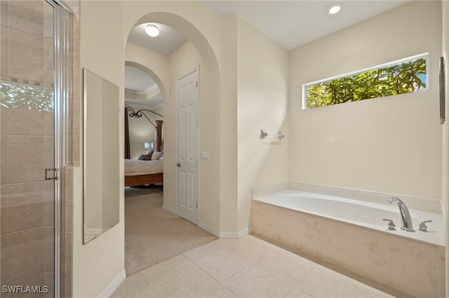 bathroom featuring tile patterned floors and plus walk in shower