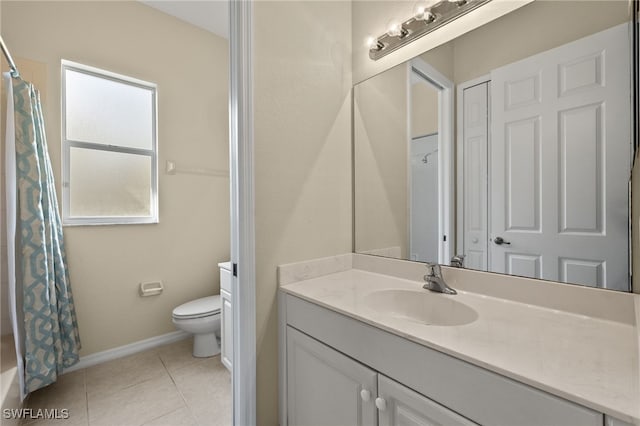 bathroom featuring tile patterned floors, toilet, and vanity