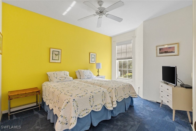 bedroom with dark carpet and ceiling fan