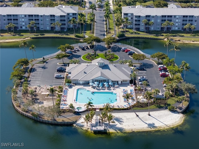 birds eye view of property with a water view