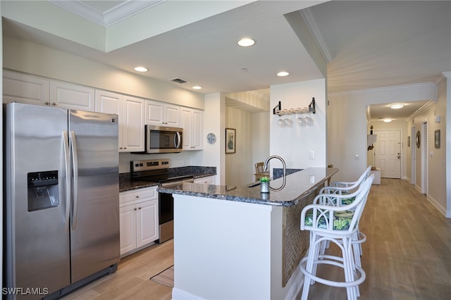 kitchen featuring white cabinetry, appliances with stainless steel finishes, and sink