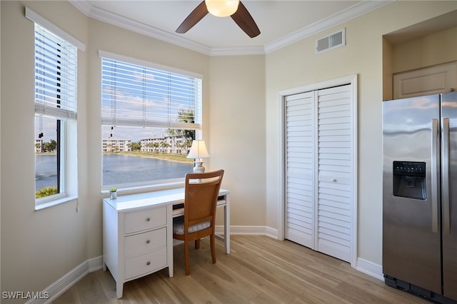 home office featuring ornamental molding, light hardwood / wood-style floors, and ceiling fan