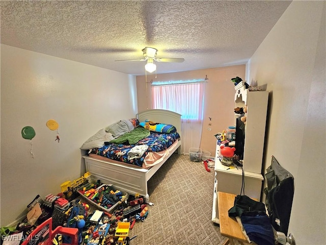 carpeted bedroom with a textured ceiling and ceiling fan