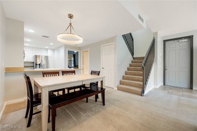 view of carpeted dining space