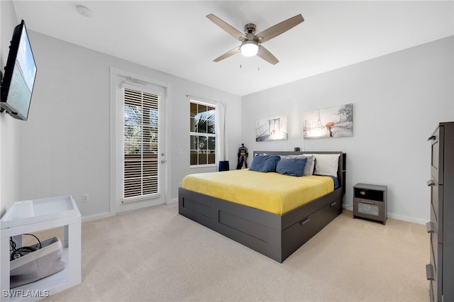 bedroom with light carpet, access to outside, and ceiling fan