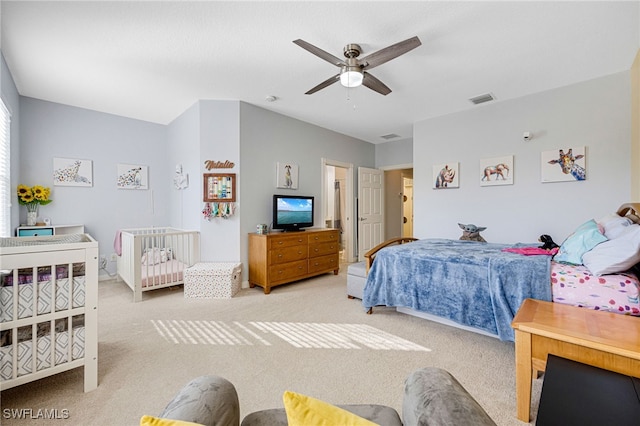 carpeted bedroom featuring ceiling fan