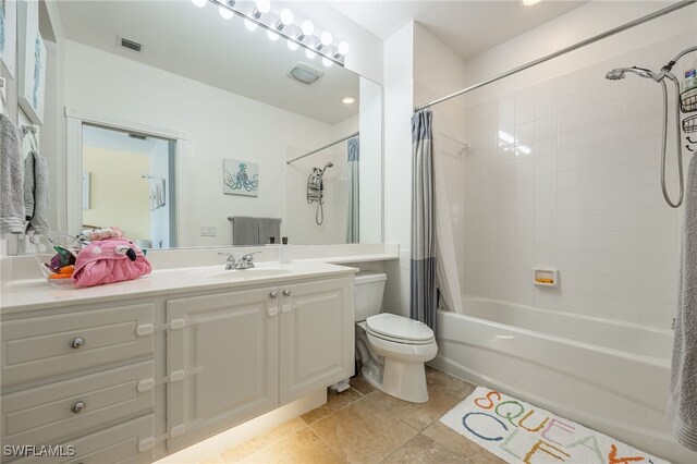 full bathroom with toilet, vanity, shower / bathtub combination with curtain, and tile patterned flooring