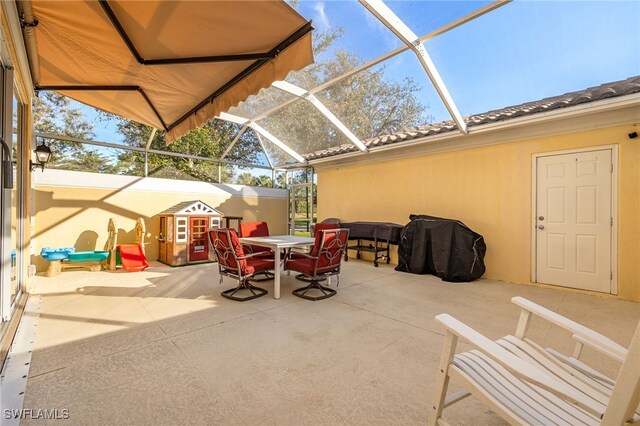 view of patio / terrace with glass enclosure