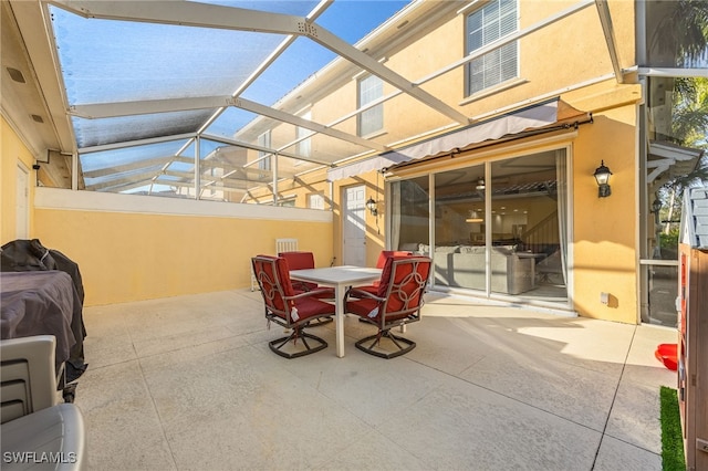 view of patio / terrace with a lanai