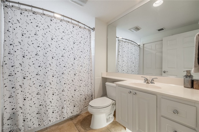 bathroom with vanity, a shower with curtain, tile patterned floors, and toilet