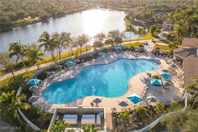 view of pool featuring a patio area and a water view