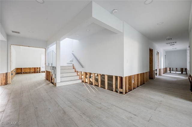 hall with light hardwood / wood-style floors