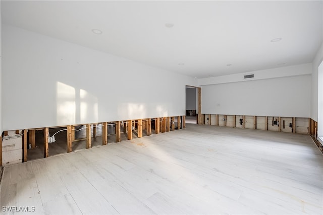 unfurnished room with light hardwood / wood-style flooring