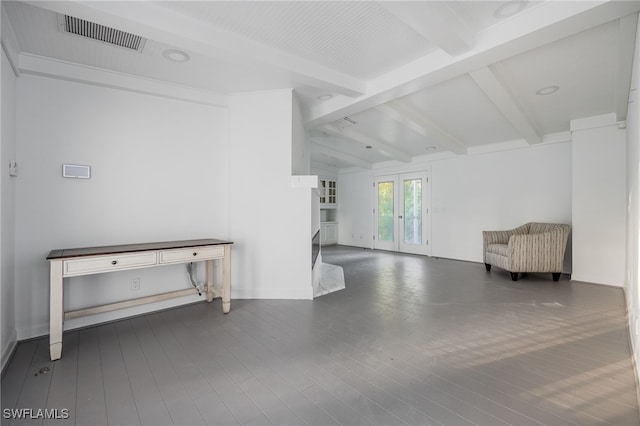 interior space featuring dark hardwood / wood-style flooring, beam ceiling, and french doors