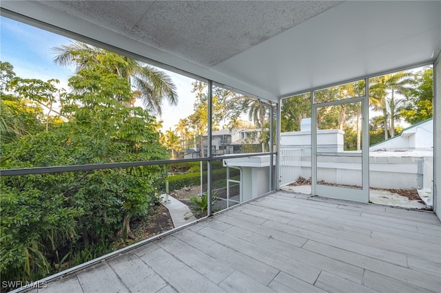 unfurnished sunroom with a wealth of natural light