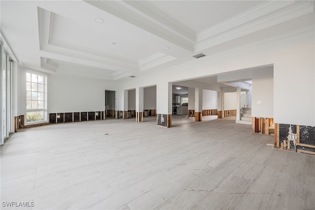 interior space with ornamental molding, beam ceiling, and light hardwood / wood-style flooring