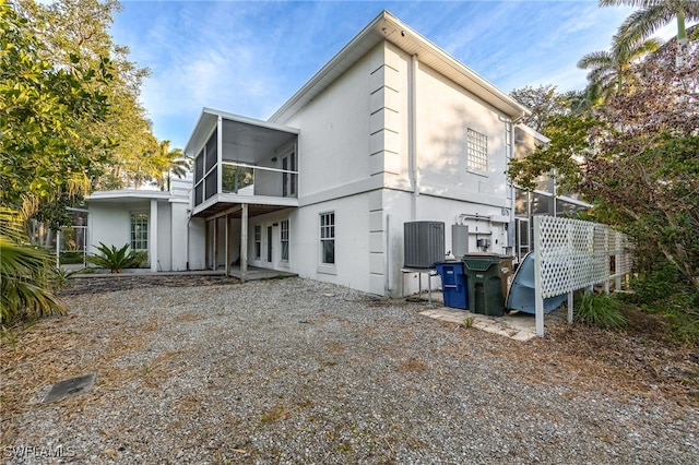 back of property featuring a sunroom