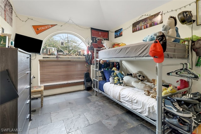 bedroom with lofted ceiling