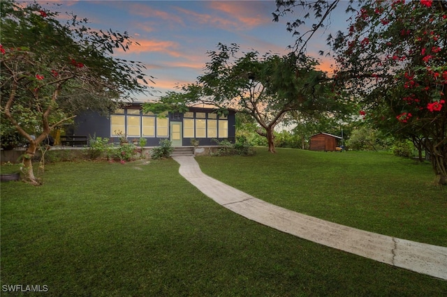 yard at dusk with a shed