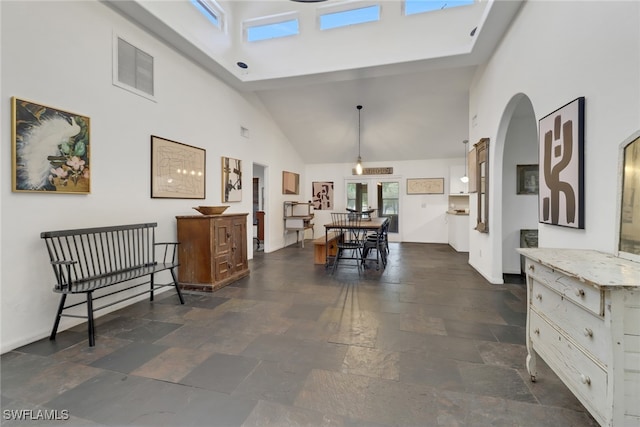 interior space featuring a towering ceiling