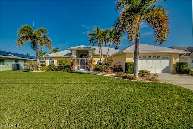 ranch-style house with a garage and a front lawn