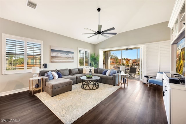 living room featuring dark hardwood / wood-style flooring, vaulted ceiling, and ceiling fan