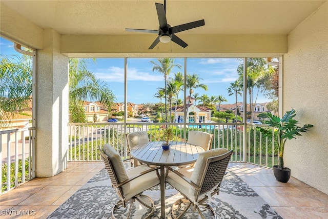 sunroom featuring ceiling fan