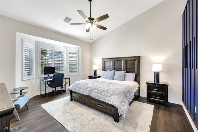 bedroom with lofted ceiling, dark hardwood / wood-style floors, and ceiling fan