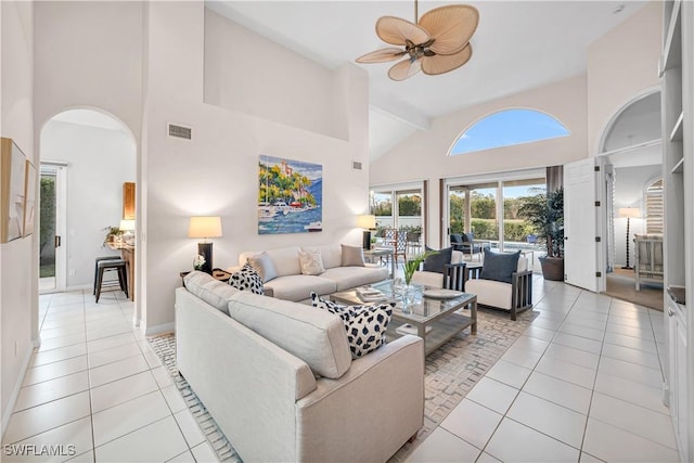 living room featuring light tile patterned floors, high vaulted ceiling, and ceiling fan