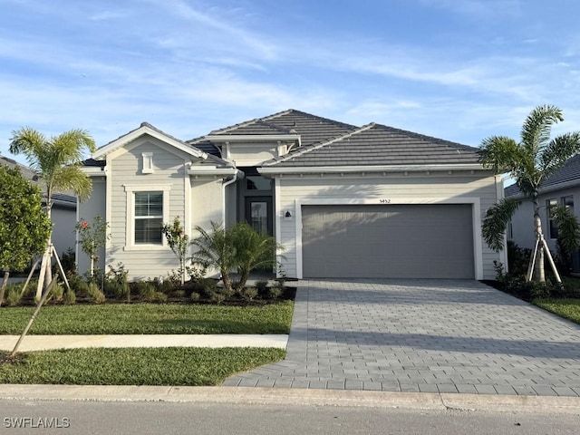 view of front of property with a garage