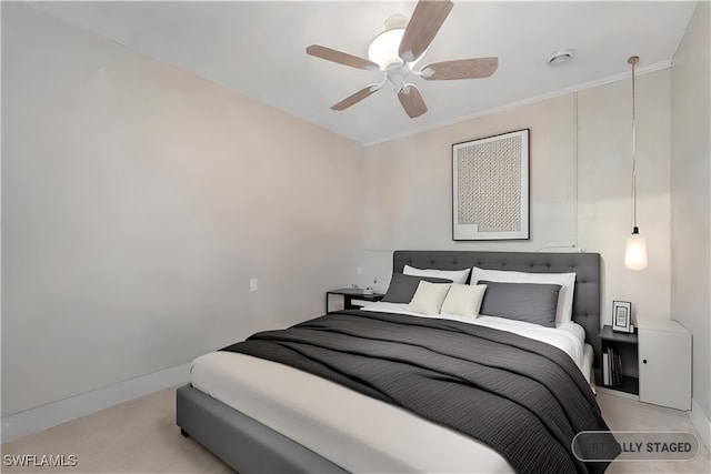 bedroom with ceiling fan and baseboards