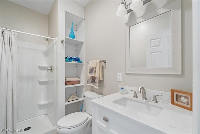 full bath featuring toilet, a shower stall, and vanity