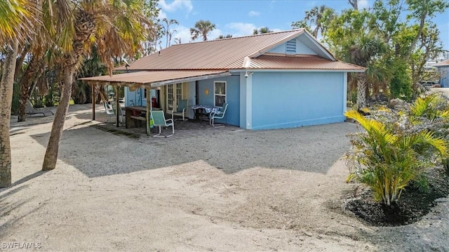 exterior space with metal roof