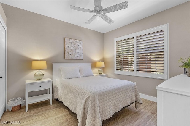 bedroom with ceiling fan and light wood-type flooring