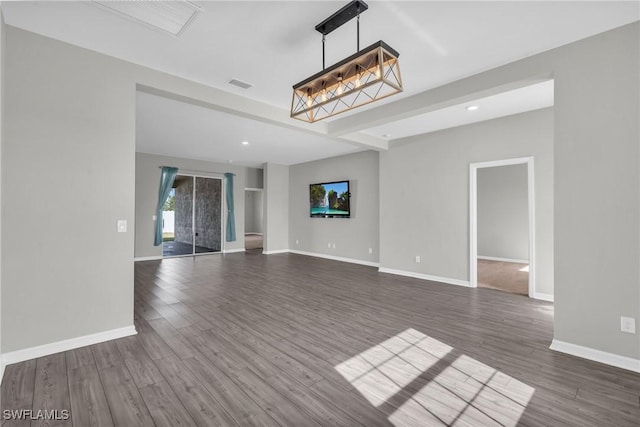 unfurnished living room with dark hardwood / wood-style floors