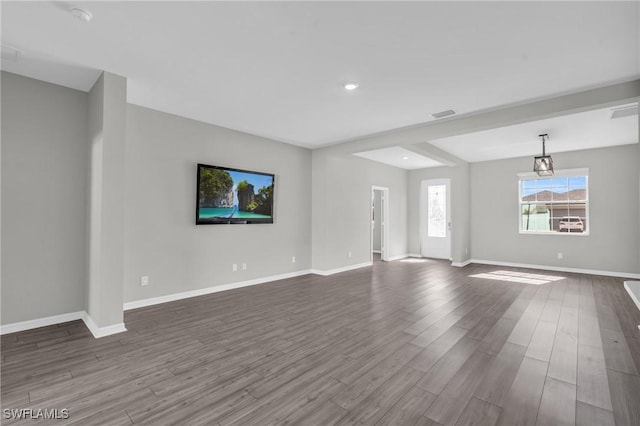 unfurnished living room featuring hardwood / wood-style floors