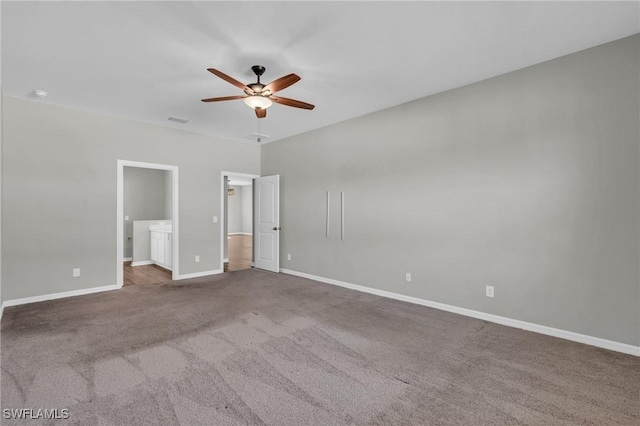 unfurnished bedroom featuring carpet flooring, connected bathroom, and ceiling fan