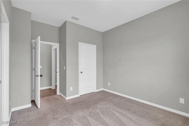 unfurnished bedroom with light carpet