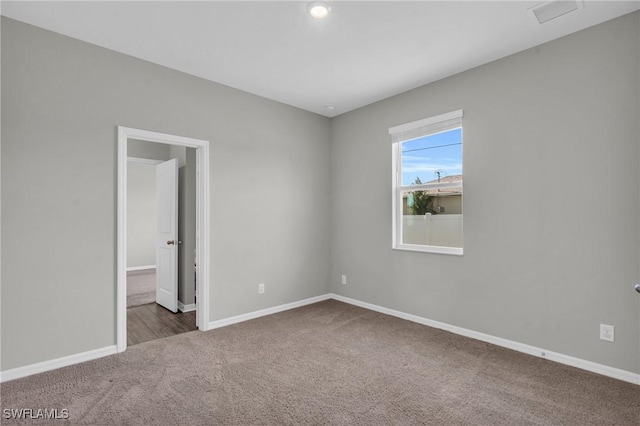 unfurnished room with carpet floors