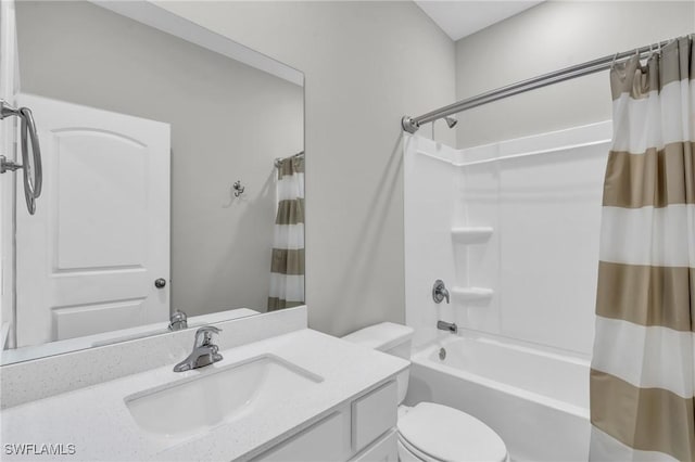 full bathroom featuring vanity, toilet, and shower / bath combo with shower curtain