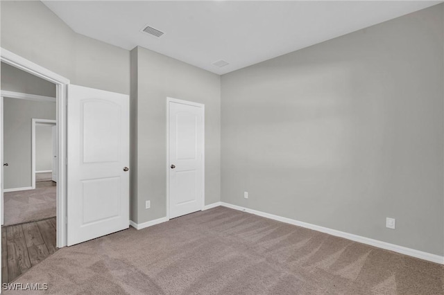 unfurnished bedroom featuring carpet flooring