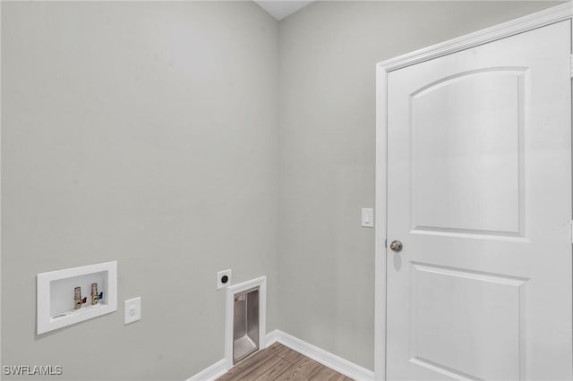 laundry area featuring washer hookup, hookup for an electric dryer, and light hardwood / wood-style flooring